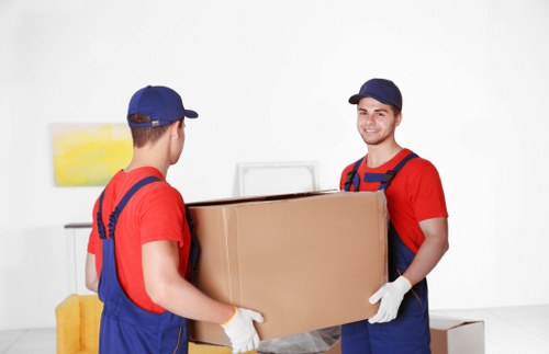 Packed boxes and furniture ready for flat removals in Tufnellpark