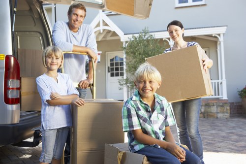 Professional movers handling boxes during a small removals job in Tufnellpark